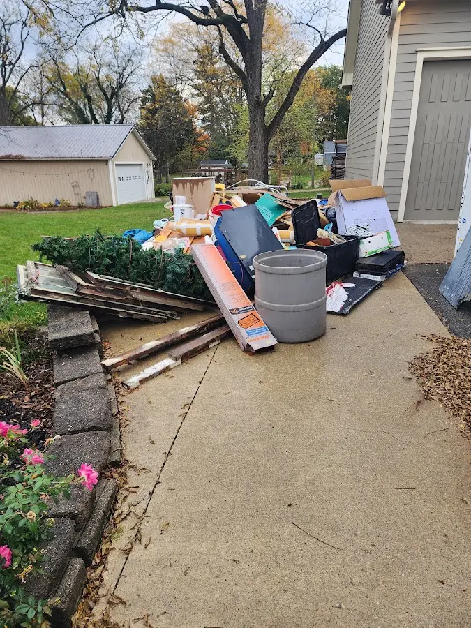 Dumpster being loaded with debris for Roofing Dumpster Rental in El Cerro Mission